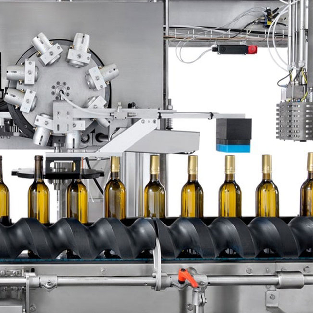Machine de placement de capsules de vin et de thermorétraction